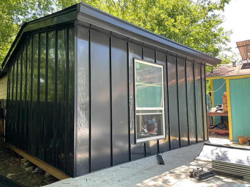 Black standing seam metal wall panels for Roof Inspection in Newberry